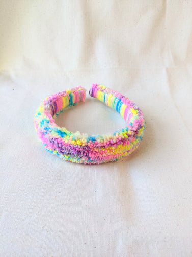 This is a detail image of a rainbow shaveded punch needle headband. The colors ranges from bright yellow to teal to pink to purple. Holo Rainbow Headband 01 | dancing arms | Punch Needle Headband